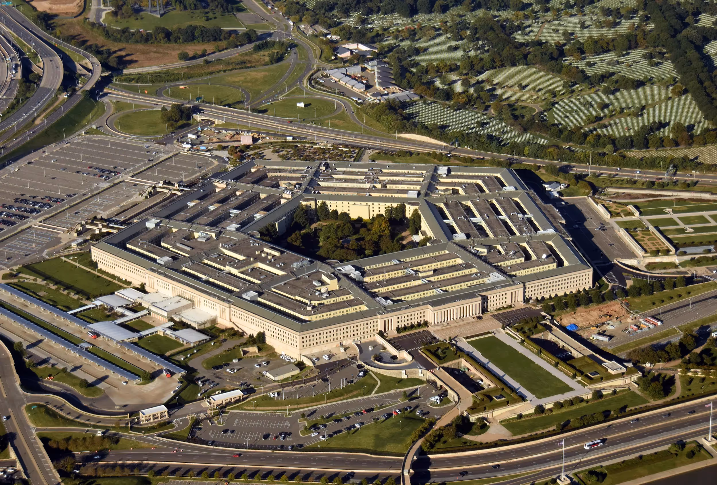 A modern, high-security Department of Defense facility exterior.